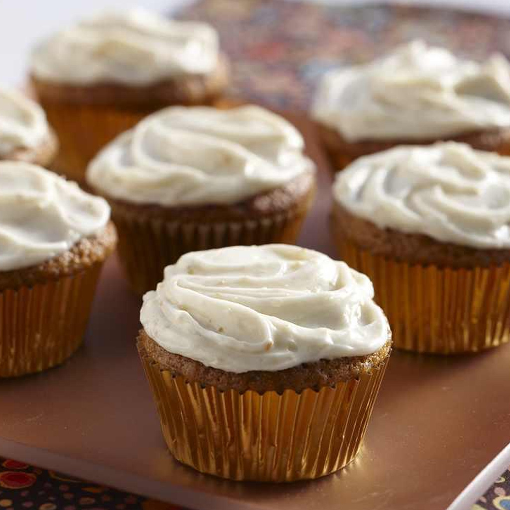 pumpkin cupcakes with orange cream cheese frosting